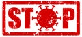 Red grunge stamp with a text STOP to slow down the corona virus COVID-19 infection with O replaced by the illustration of the Royalty Free Stock Photo