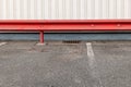 red guardrail in a parking lot Royalty Free Stock Photo