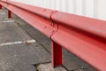 red guardrail in a parking lot Royalty Free Stock Photo