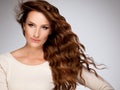 Red Hair. Beautiful Woman with Curly Long Hair Royalty Free Stock Photo