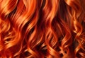 Red hair close-up as a background. Women\'s long orange hair