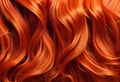 Red hair close-up as a background. Women\'s long orange hair