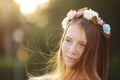 Red hair Girl Portrait in circlet of flowers on nature green background Royalty Free Stock Photo