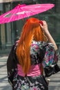 Red Hair Girl with Traditional Japanese Pink Wagasa Umbrella Royalty Free Stock Photo