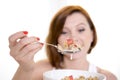 Red hair happy woman eating cereal stawberries Royalty Free Stock Photo