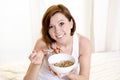 Red hair happy woman eating cereal stawberries Royalty Free Stock Photo