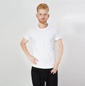 Red hair man in blank t-shirt isolated, male tshirt copy space. T shirt mock up Royalty Free Stock Photo