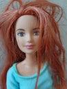 A red hair portrait barbie with blue shirt