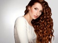 Red Hair. Woman with Beautiful Curly Hair Royalty Free Stock Photo