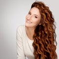 Red Hair. Woman with Beautiful Curly Hair Royalty Free Stock Photo