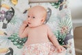 Red-haired baby lies on a changing table. safety for children. Royalty Free Stock Photo