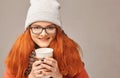 Red-haired beauty with a cup of coffee Royalty Free Stock Photo