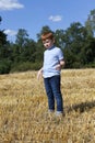 portrait of a seven-year-old boy in a field Royalty Free Stock Photo