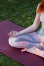 A Red-Haired Fair-Skinned Woman Practicing Yoga and Meditation in the Forest