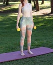 A Red-Haired Fair-Skinned Woman Practicing Yoga and Meditation in the Forest