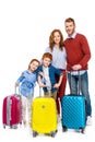 red haired family with suitcases standing together and smiling at camera Royalty Free Stock Photo