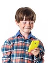 Red-haired funny boy with mobile phone Royalty Free Stock Photo