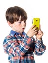 Red-haired funny boy with mobile phone Royalty Free Stock Photo