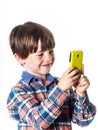 Red-haired funny boy with mobile phone Royalty Free Stock Photo