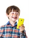 Red-haired funny boy with mobile phone Royalty Free Stock Photo