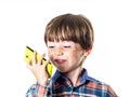 Red-haired funny boy with mobile phone Royalty Free Stock Photo