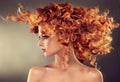 Red haired girl with curly hairstyle. Royalty Free Stock Photo