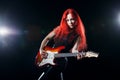 Red-haired girl the guitarist Royalty Free Stock Photo