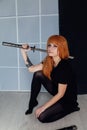 Red-haired girl with a Japanese sword cosplayer anime Japan Royalty Free Stock Photo