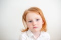 Red-haired girl looks thoughtfully Royalty Free Stock Photo