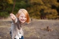 Red-haired girl is playing and laughing Royalty Free Stock Photo