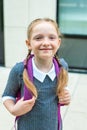 red-haired girl, schoolgirl smiles. freckled and orange braids. back to school