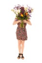 Red haired girl standing with bouquet flowers isolated over whit Royalty Free Stock Photo