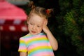 Red-haired girl in a striped colored T-shirt Royalty Free Stock Photo