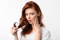 Red-Haired Girl Touching Hair Having Split Ends Problem, White Background Royalty Free Stock Photo