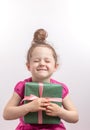 Red-haired happy girl adores her gift box