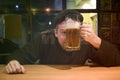 Guy and phone in the bar Royalty Free Stock Photo