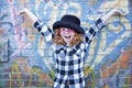 Red haired little girl in front of brick wall Royalty Free Stock Photo