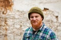Red haired man with plaid shirt looking at camera Royalty Free Stock Photo