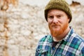 Red haired man with plaid shirt looking at camera Royalty Free Stock Photo