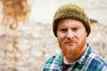 Red haired man with plaid shirt looking at camera Royalty Free Stock Photo
