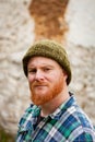 Red haired man with plaid shirt looking at camera Royalty Free Stock Photo