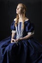 Renaissance century woman in a blue silk gown