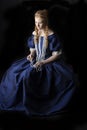 Renaissance century woman in a blue silk gown