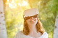 Red-haired smiling girl in virtual reality helmet Royalty Free Stock Photo