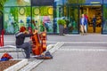 Red-haired street musicians with cello string in Norway