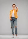 Red haired teenage girl pointing finger to you Royalty Free Stock Photo