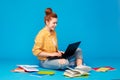 Red haired teenage student girl with laptop Royalty Free Stock Photo