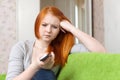 Red-haired teenager girl having disappointment