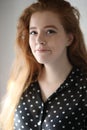 Red Haired Woman in Black Polka Dot Top and Cute Smile