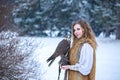 Red-haired woman with a falcon Royalty Free Stock Photo